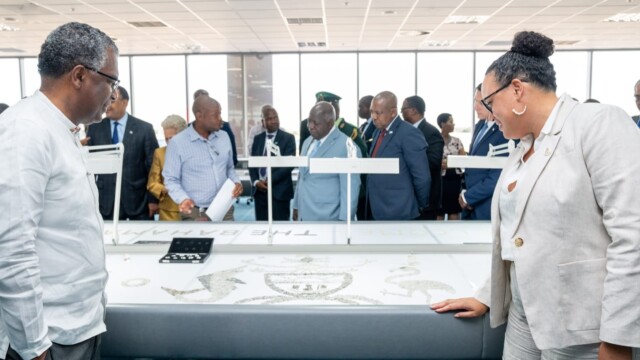 Minister the Hon Frederick A Mitchell and Director General Ali at the sorting floor of the Botswana diamond company.